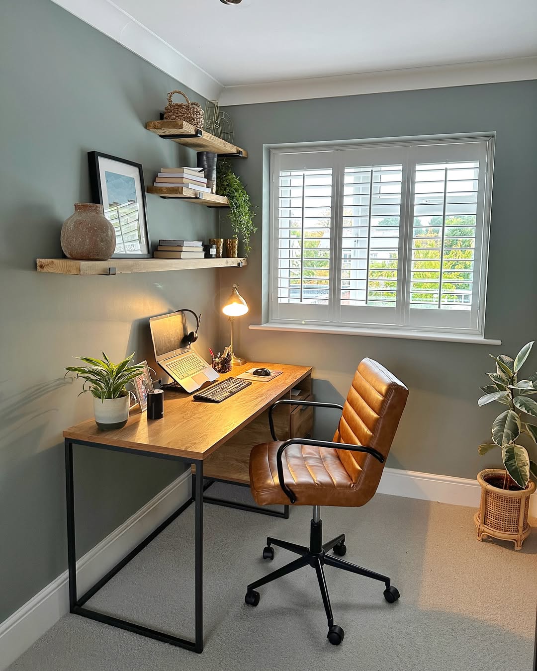 Cool sage walls create a calm focus