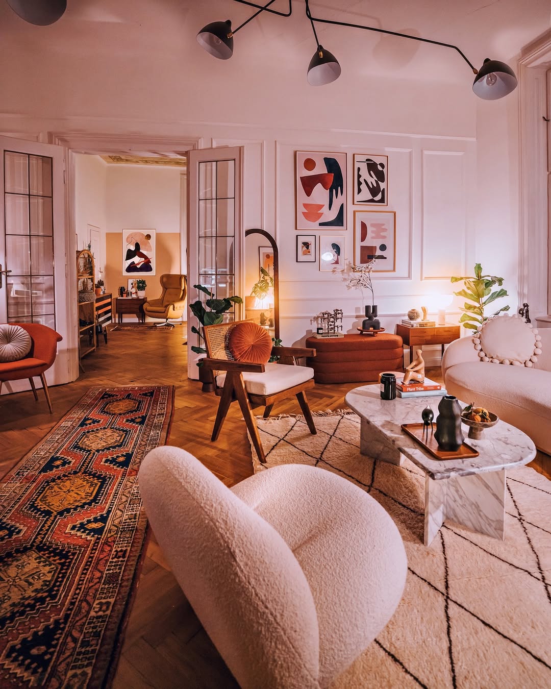 Boucle chairs, velvet pillows and rugs. Just perfect
