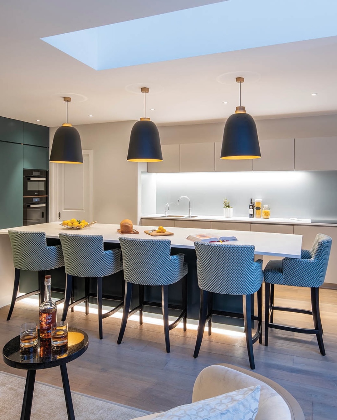 Ambient, task, and accent lighting seamlessly integrated to create a warm atmosphere