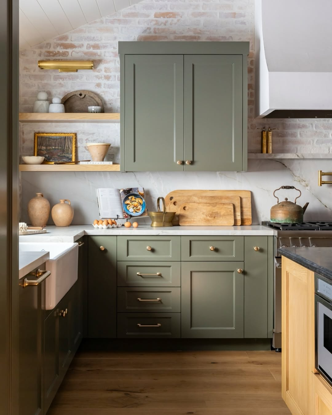 Green cabinets with brass hardware