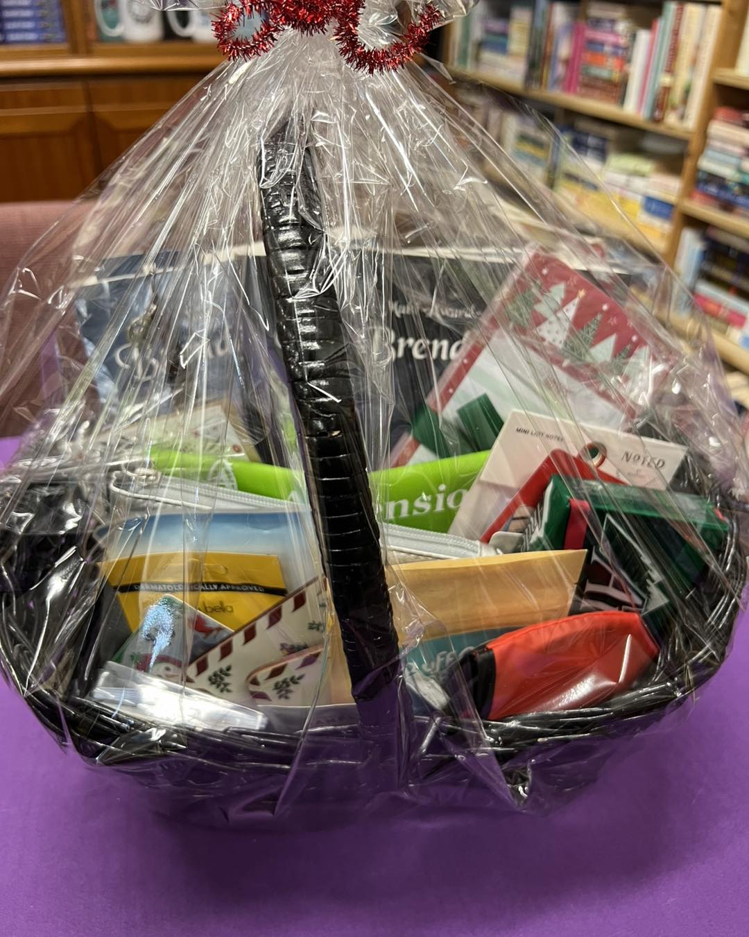 A book lover’s gift basket filled with books, bookmarks, and cozy goodies