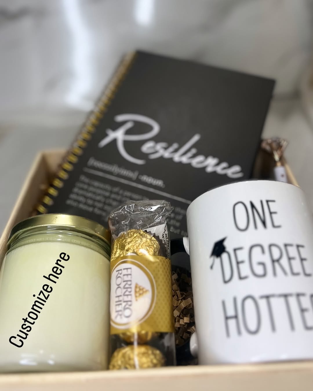 Gift box with a journal, mug, candle, and Ferrero Rocher chocolates