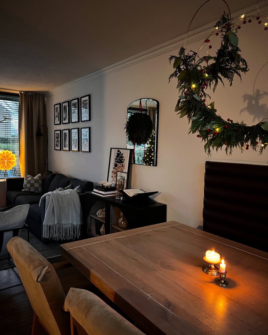 Layered lights from candles, lamps give the perfect moody Christmas vibe